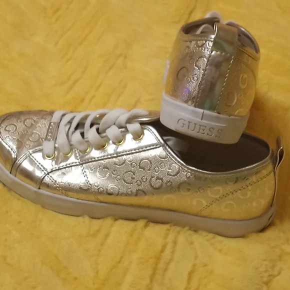 Guess gold tennis shoes top